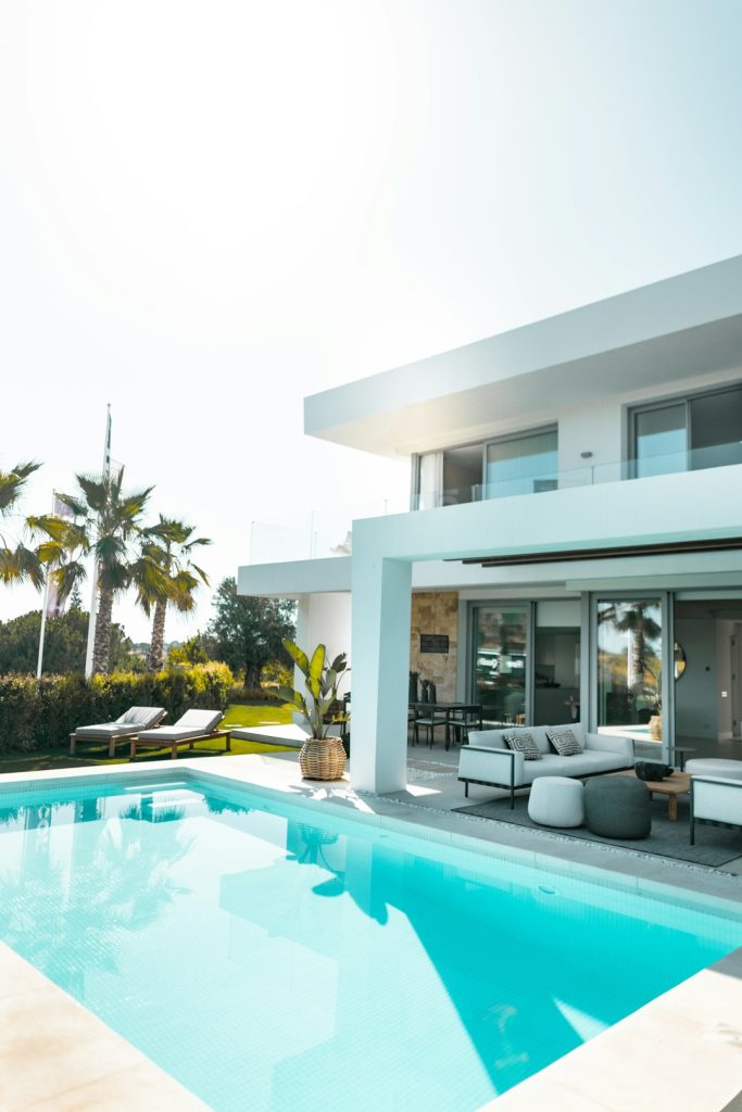 white-concrete-building-with-swimming-pool-y3-ahhrxuby