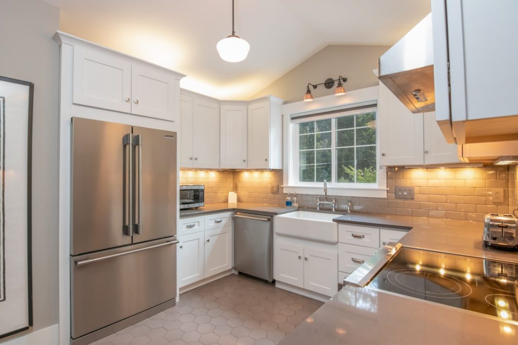 apartment-sized kitchen with steel appliances.